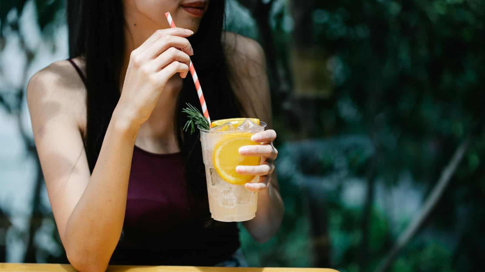 Woman drinking a cup of lemonade