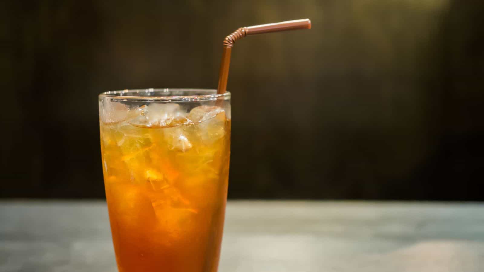 Glass of iced tea with straw