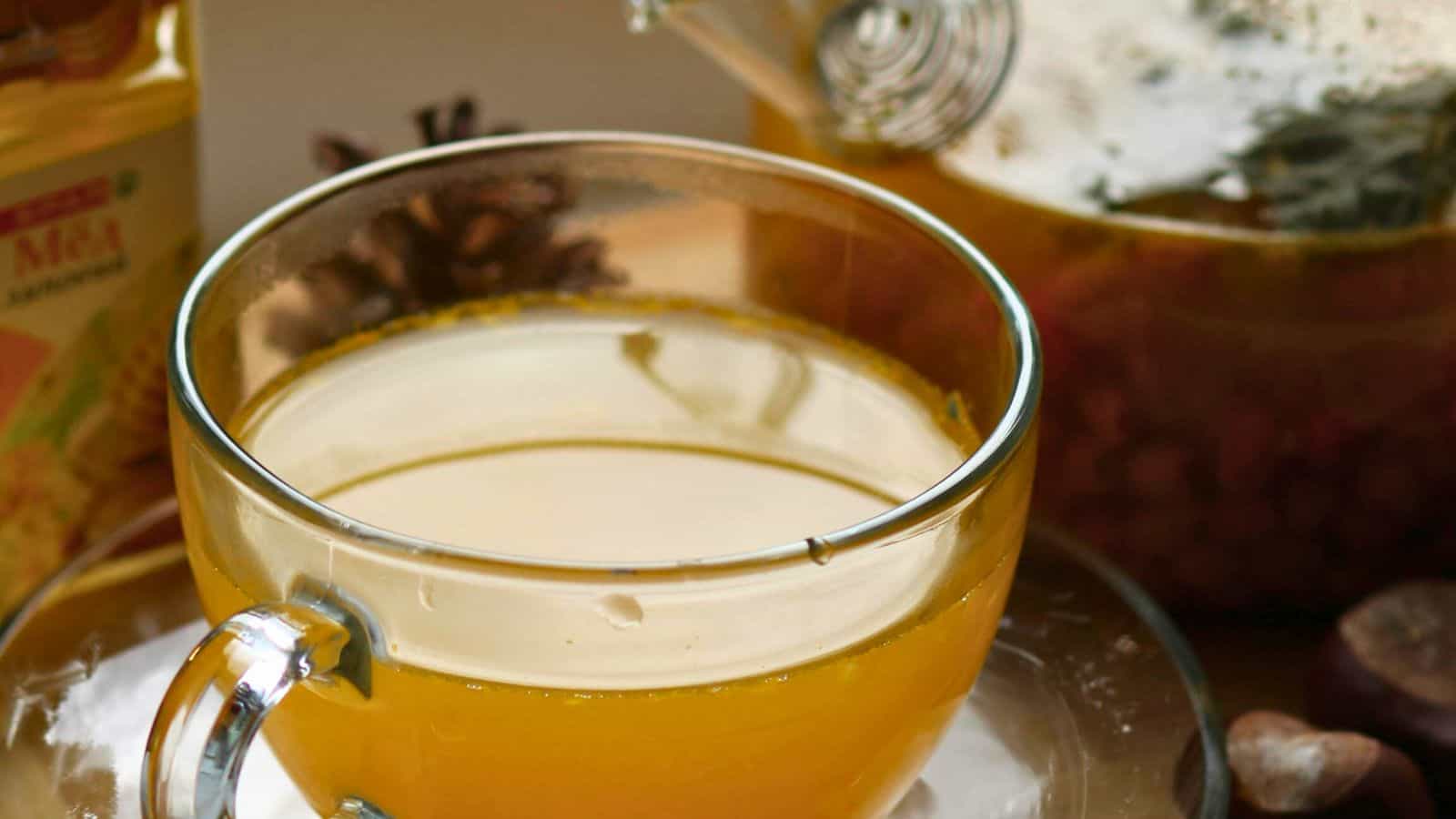 Close-up of ginger tea in a glass cup