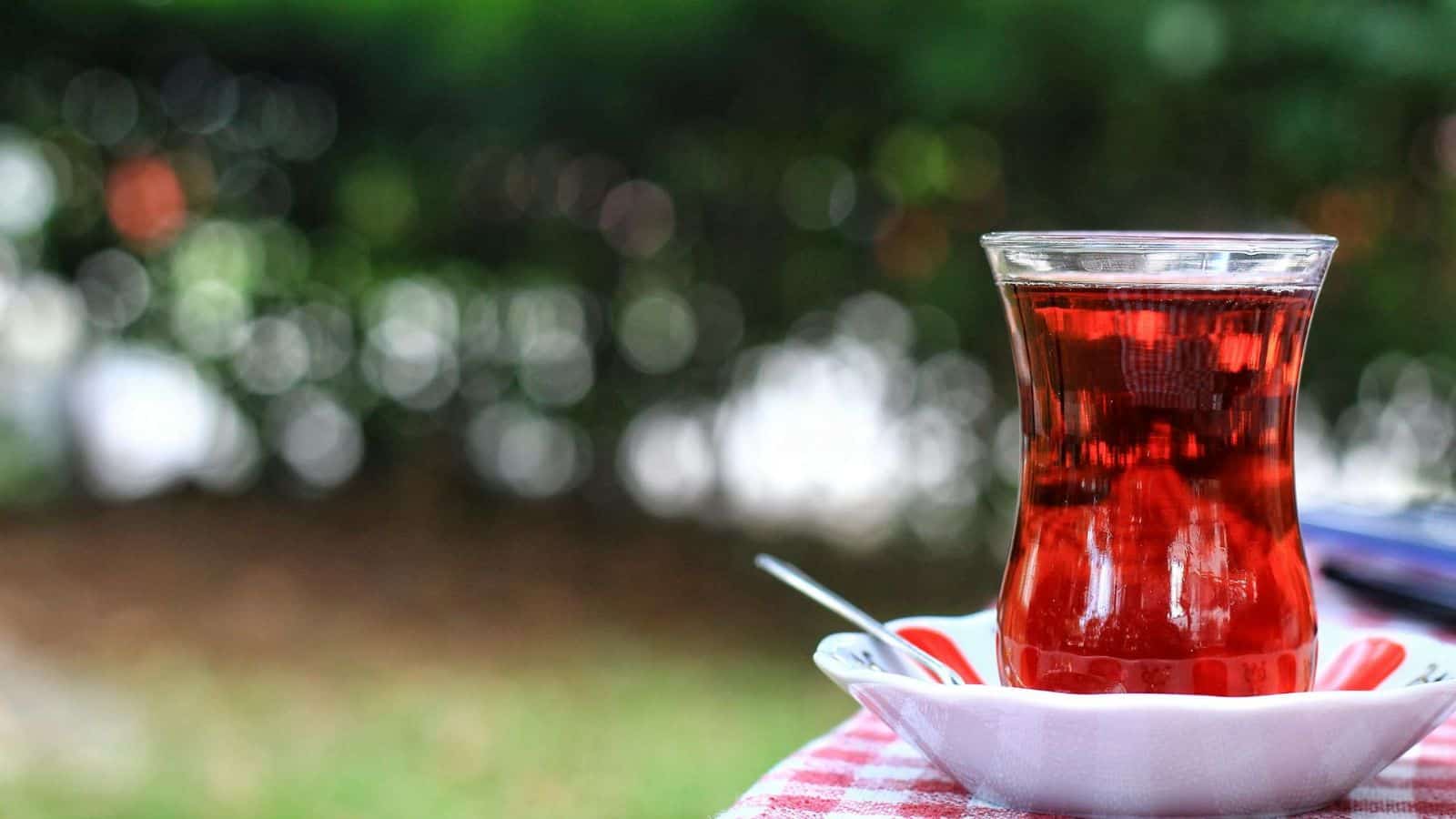 Tall and wide glass of red tea