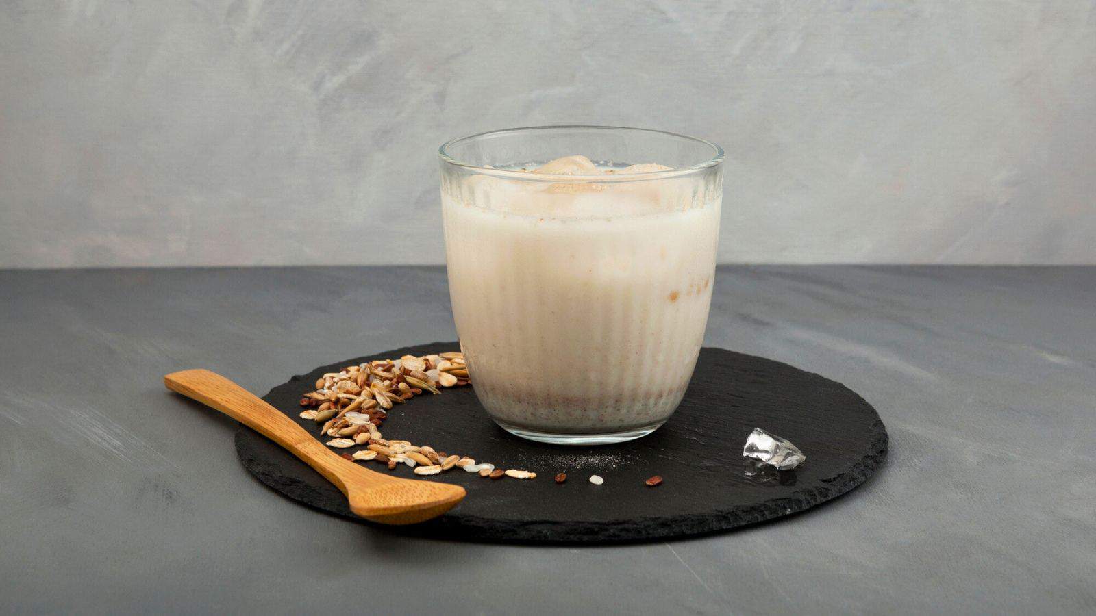 Cup of white tea on a coaster 