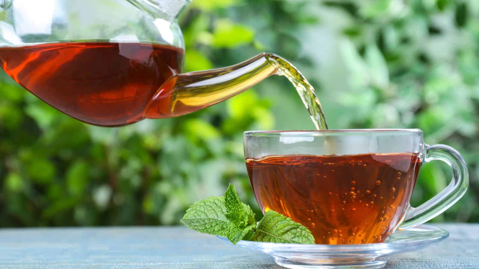 Tea being poured onto a cup
