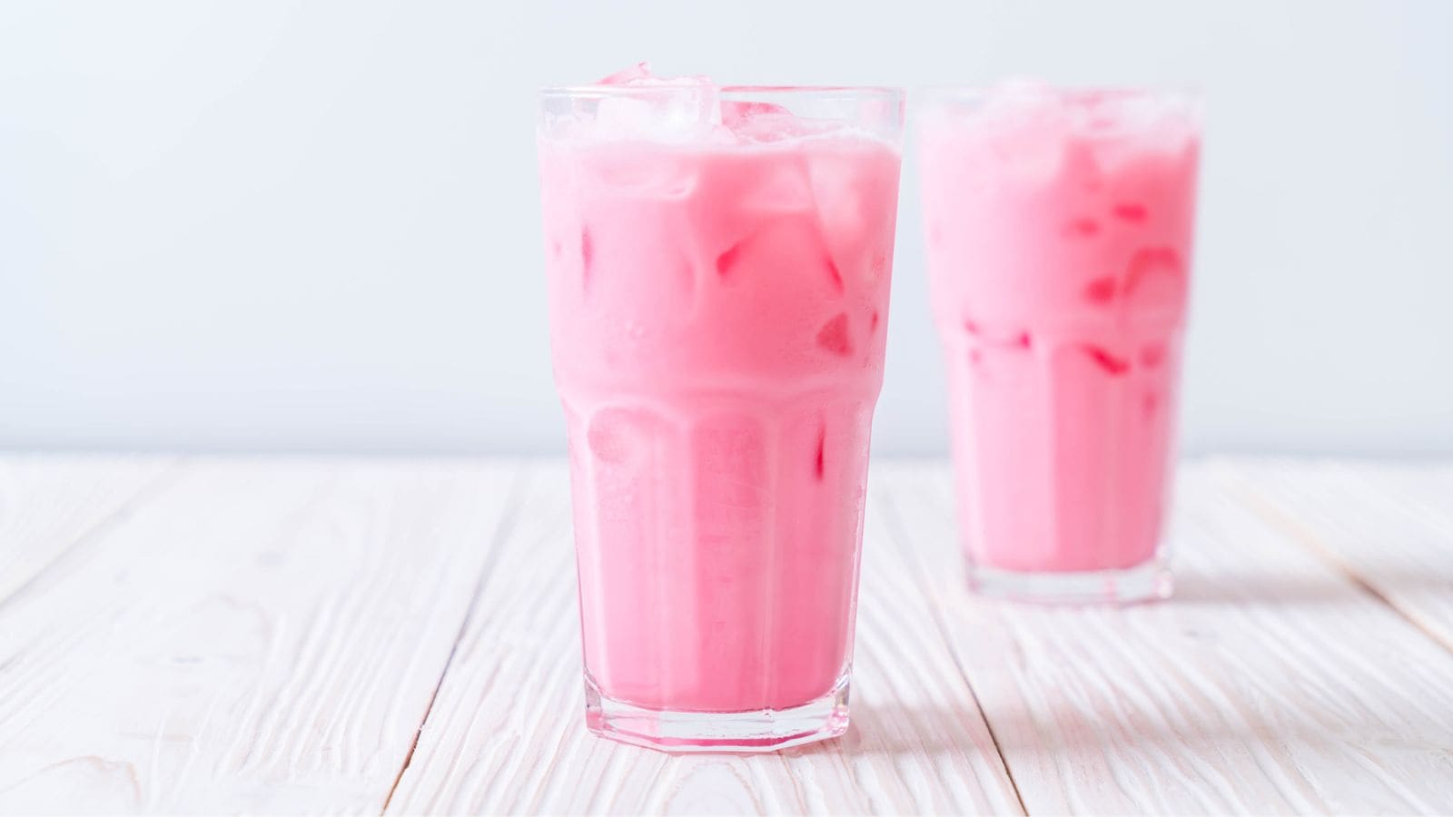 Two glasses of pink drinks