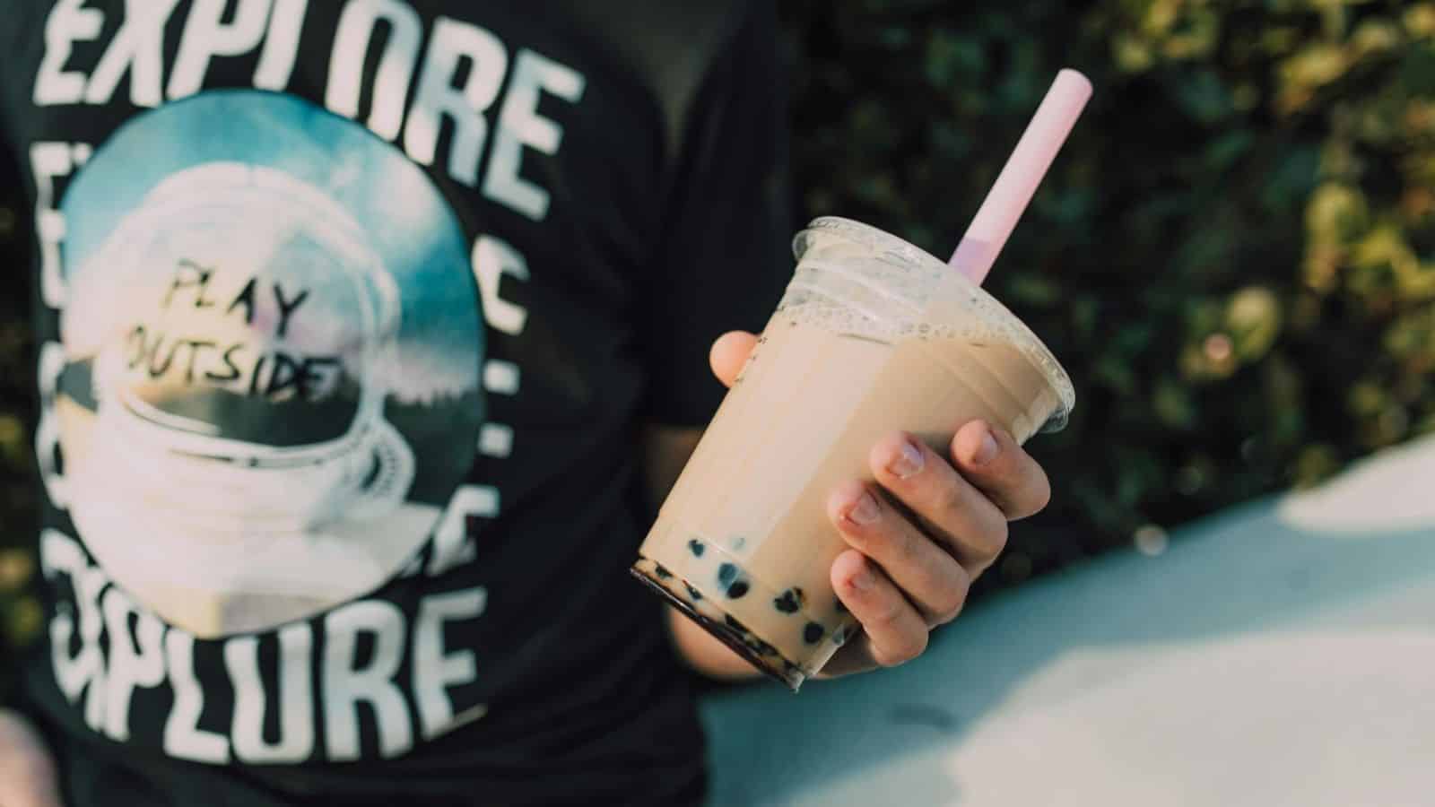 Person holds a cup of boba tea
