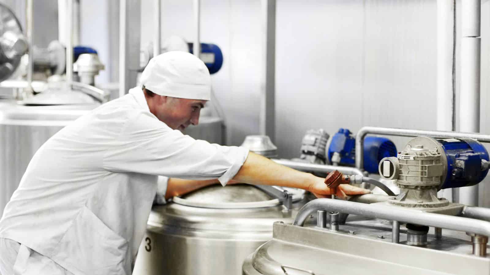 Man working in a dairy processing facility