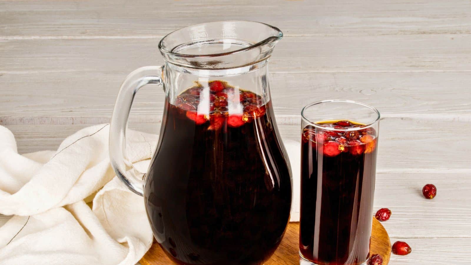 A decanter and glass of rosehip juice