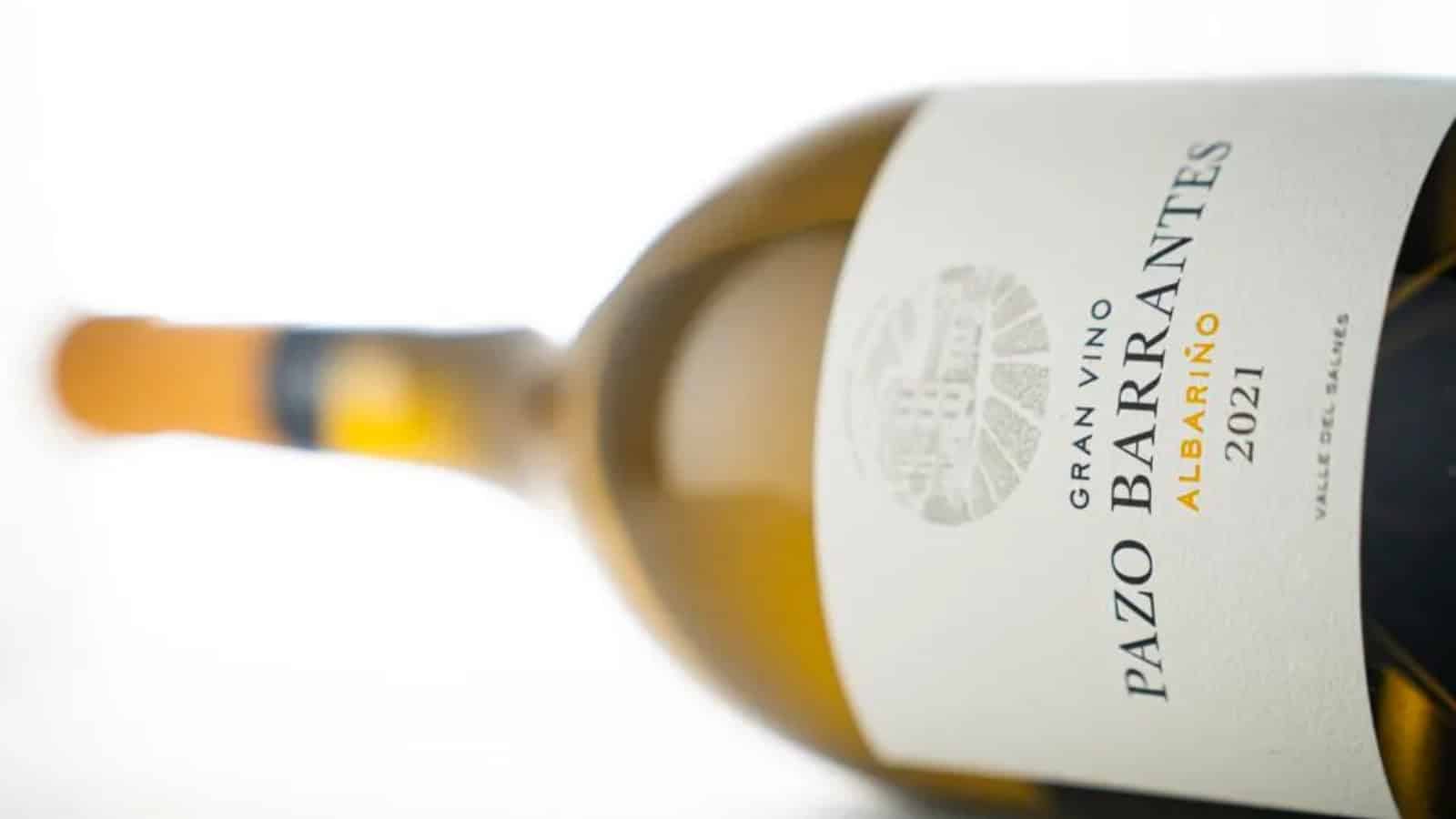 A bottle of Albarino on its side.