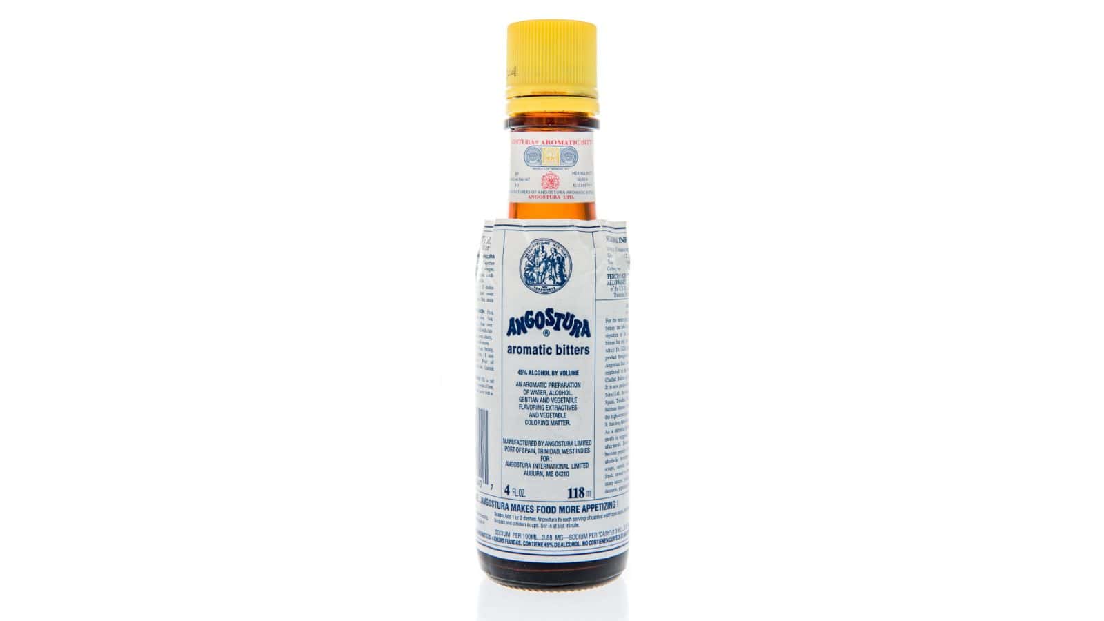 A bottle of Angostura aromatic bitters with a white label and yellow cap is displayed against a white background. The label details ingredients and branding information.
