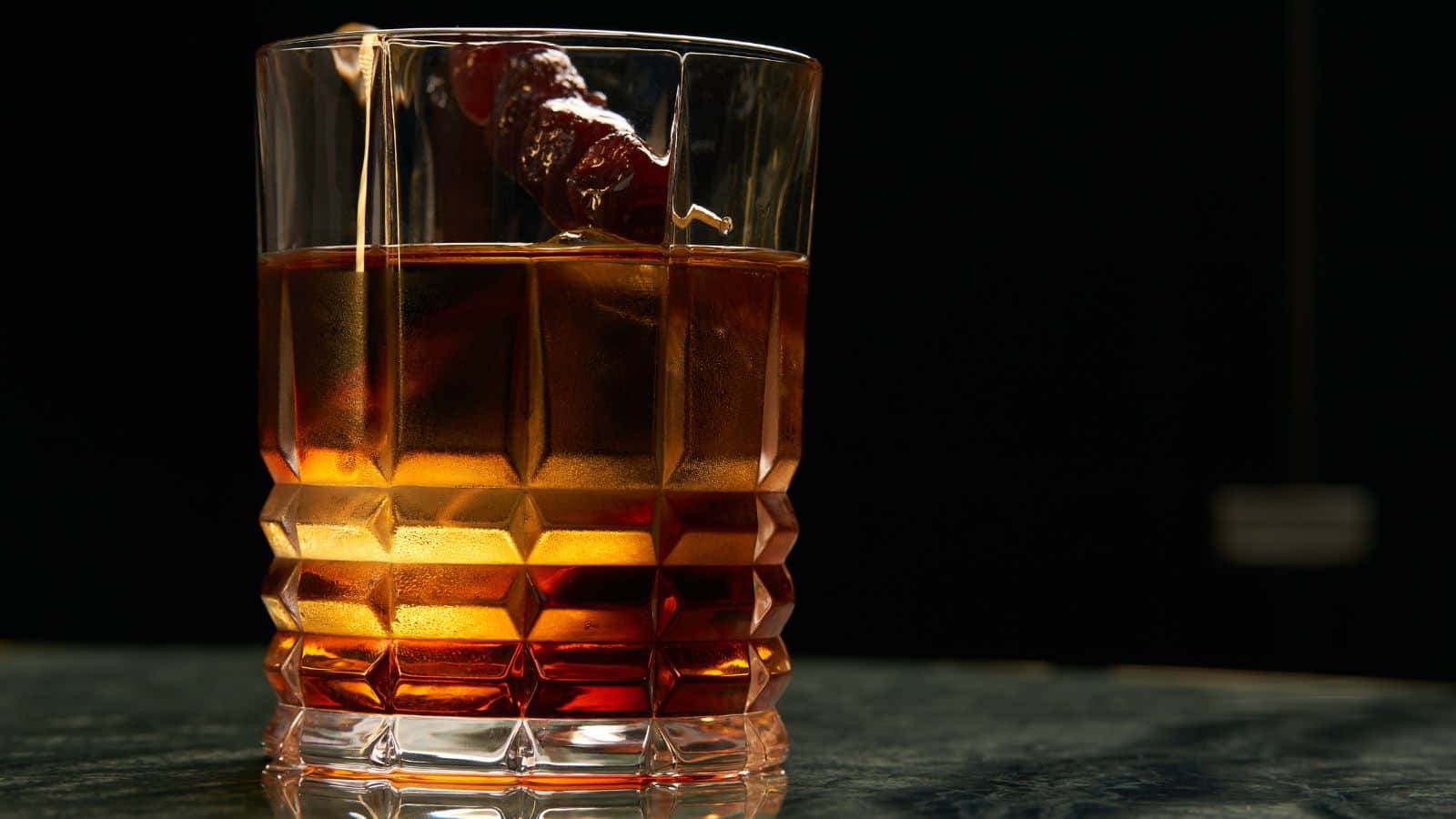 A glass of alcoholic beverage.