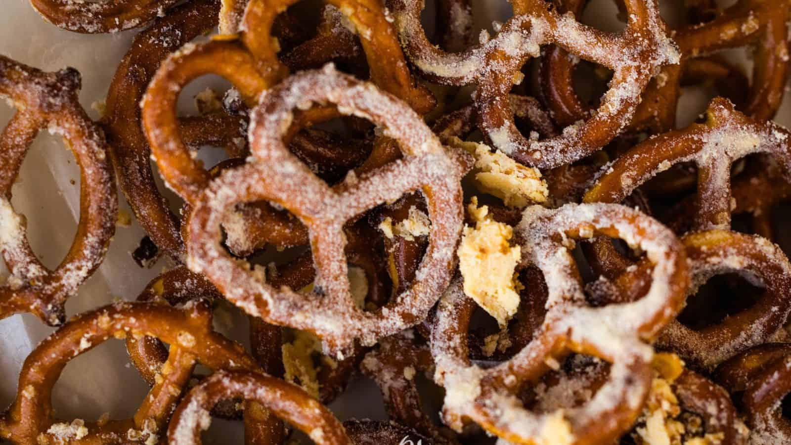 A pile of pretzels on a white plate.