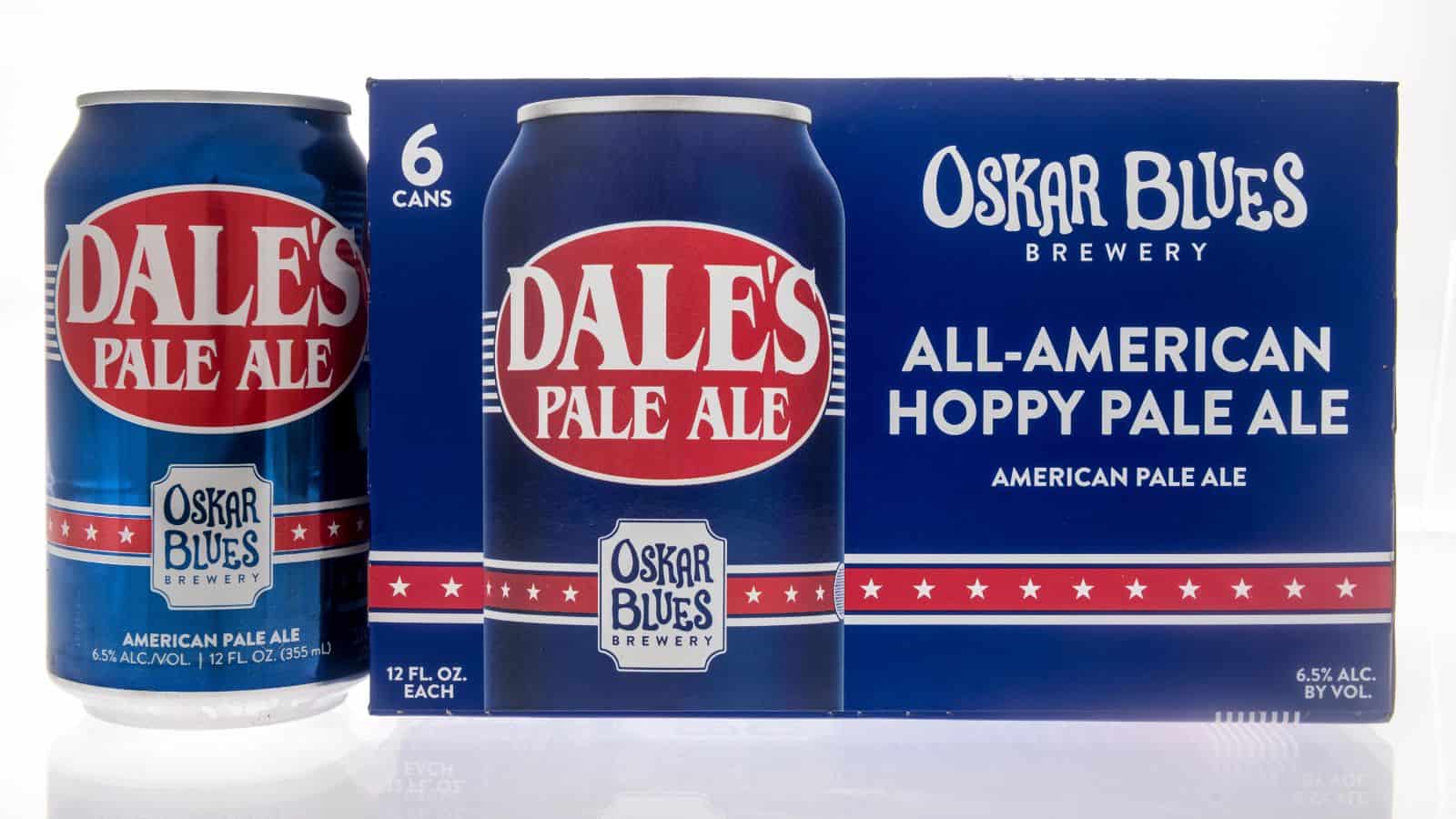 A can and a six-pack box of Dale's Pale Ale from Oskar Blues Brewery are shown. The packaging is blue with red and white accents, featuring the text "All-American Hoppy Pale Ale." The can size is 12 fl. oz., with 6.5% alcohol by volume.
