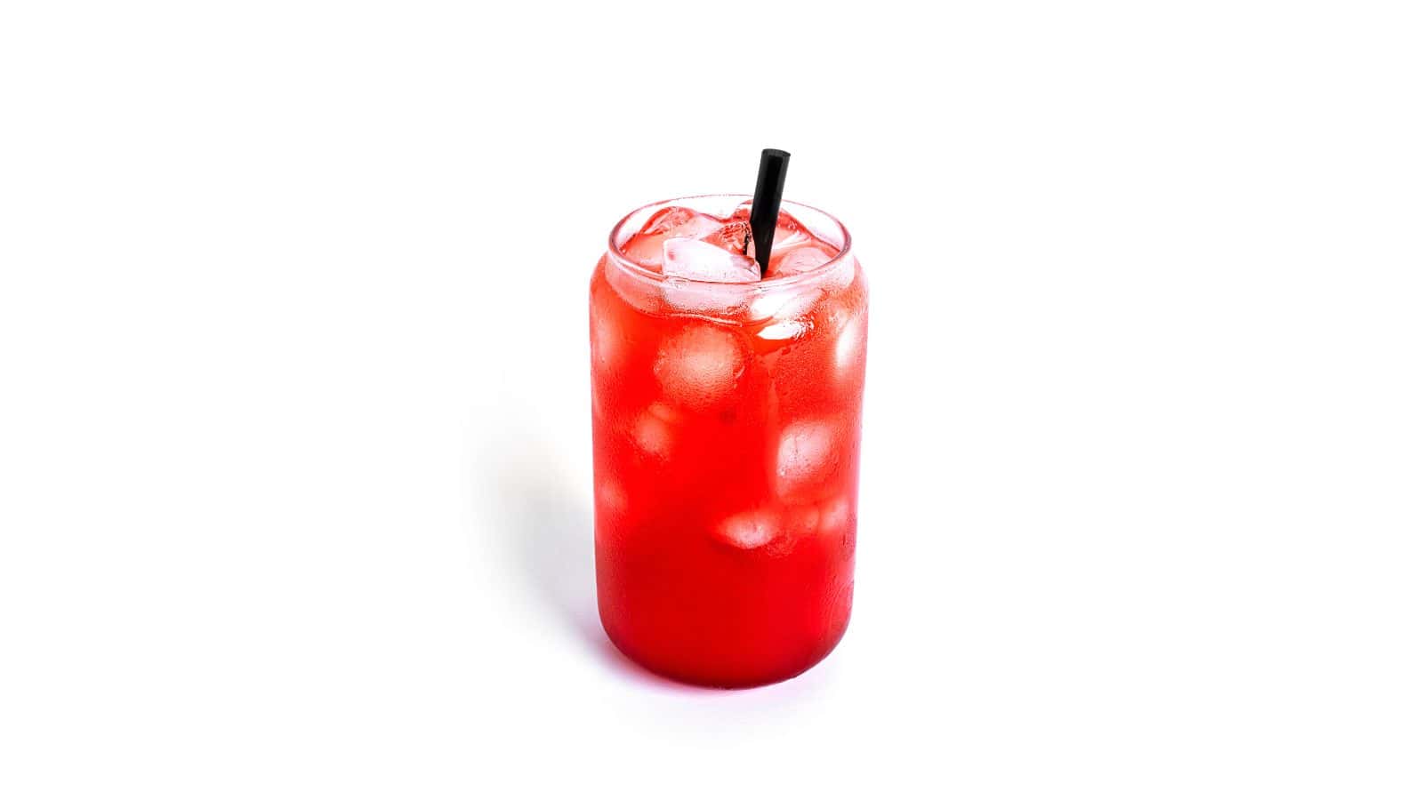 A red iced drink served in a glass with a black straw. The glass is filled with ice cubes, and the background is plain white.
