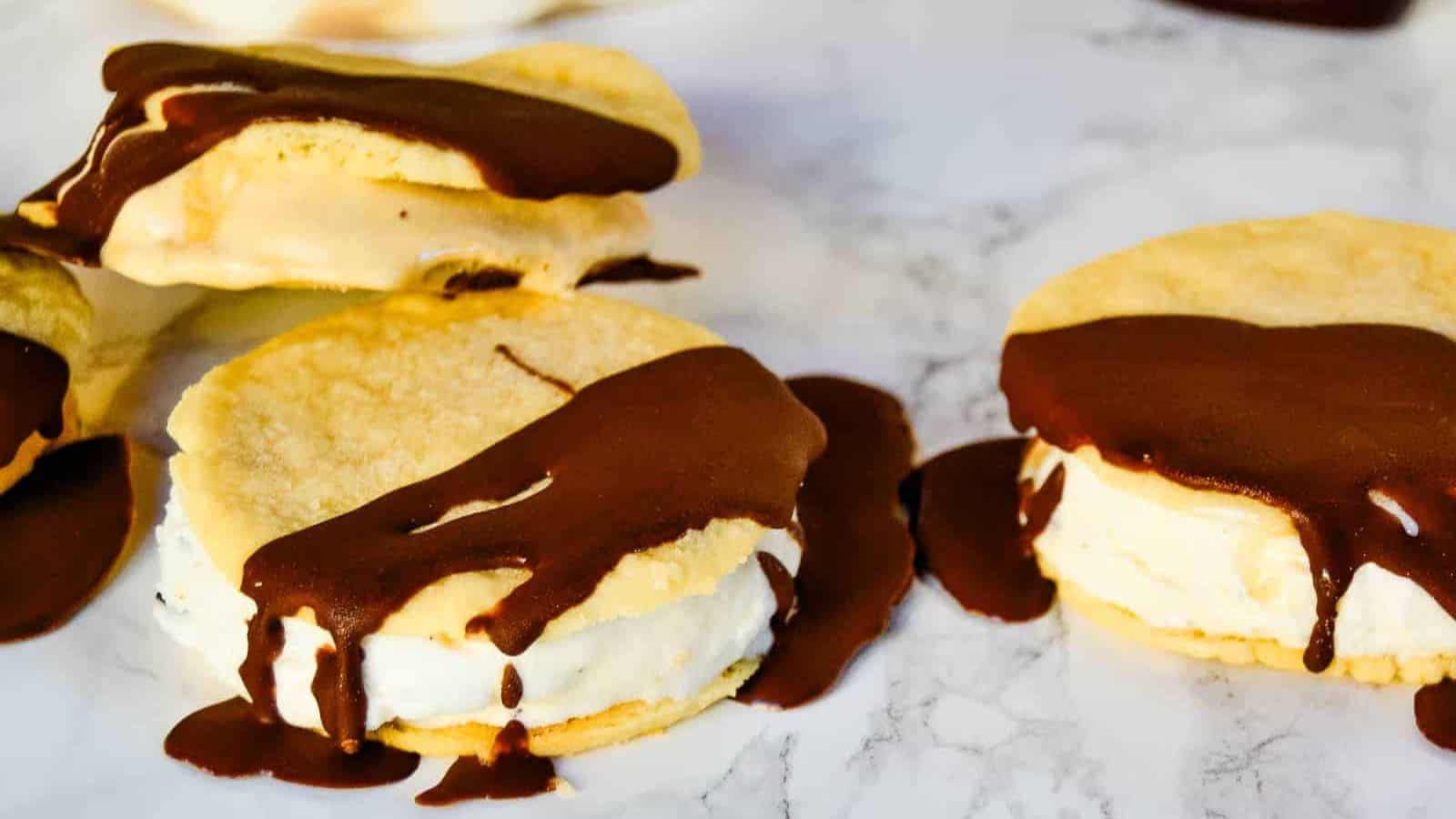 Ice cream sandwiches with chocolate drizzle.