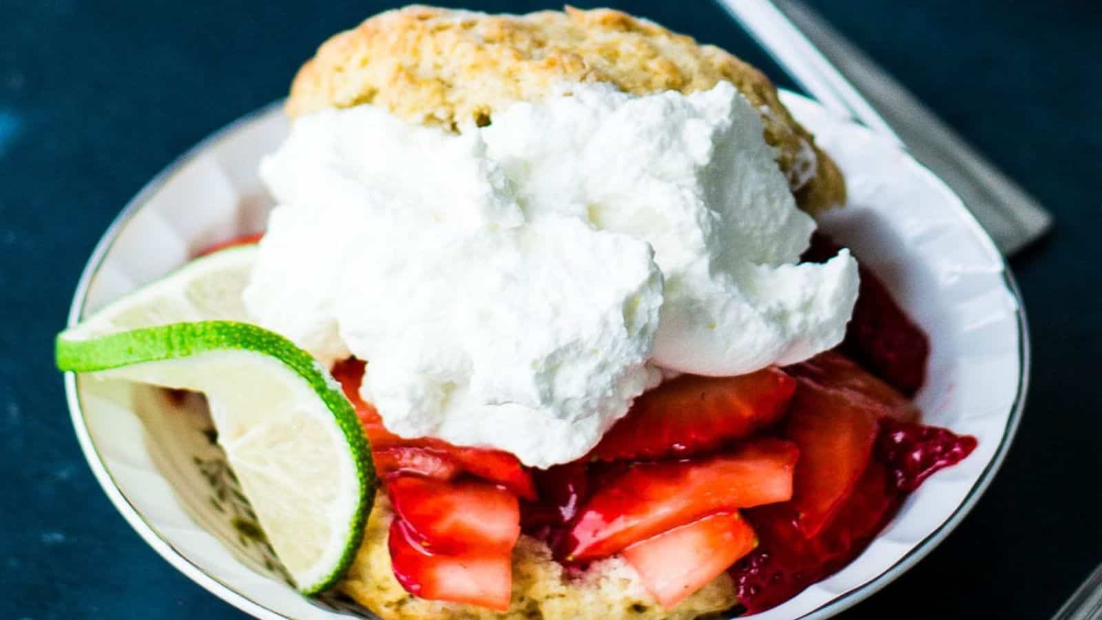 Strawberry shortcake with brown sugar biscuits and whipped cream.