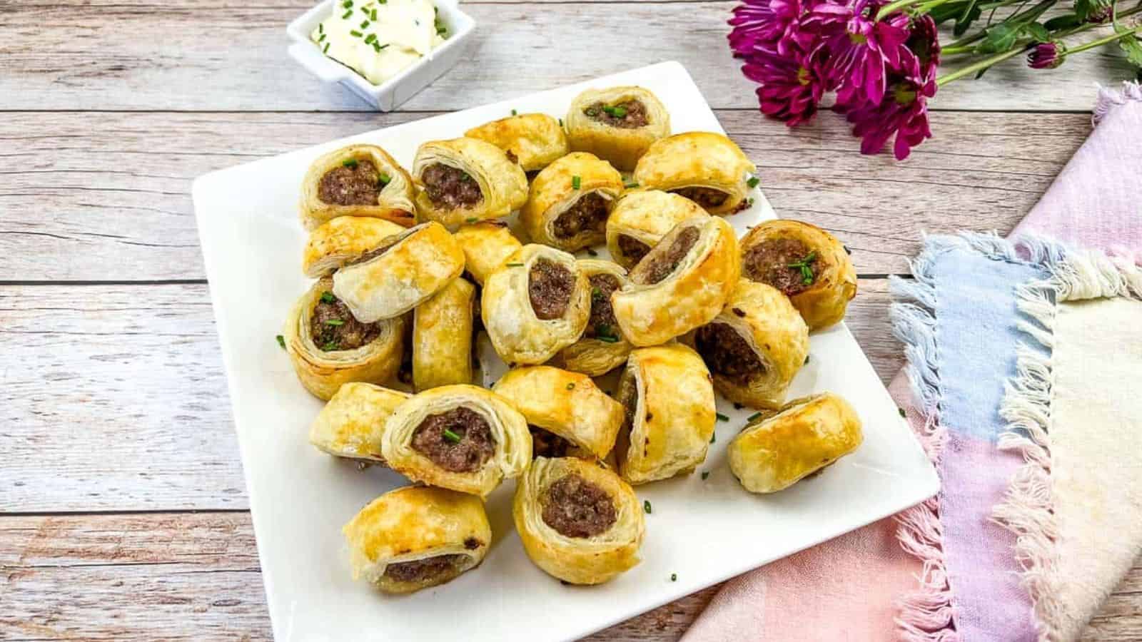 Sausage Rolls on a white plate.