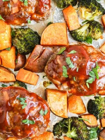 A sheet pan filled with meatballs, broccoli and potatoes.