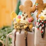 Indulge in this Gingerbread Freakshake&mdash;a chocolate milkshake topped with whipped cream, candy, sprinkles, and a festive gingerbread cookie. Perfect for your next Christmas recipe adventure!.
