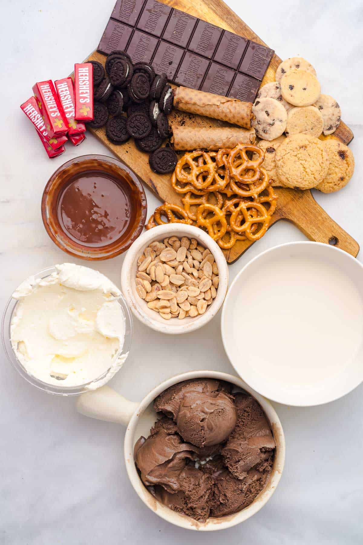Indulge in a decadent Chocolate Freakshake with assorted chocolate, cookies, pretzels, peanuts, whipped cream, chocolate sauce, milk, and rich chocolate ice cream.