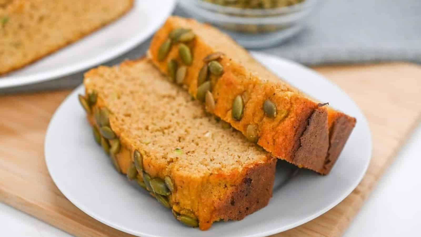 Two slices of zucchini bread on a plate.