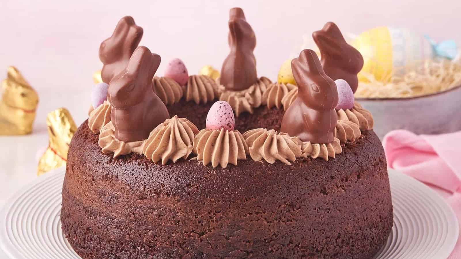 Chocolate Easter bundt cake topped with bunny decorations.