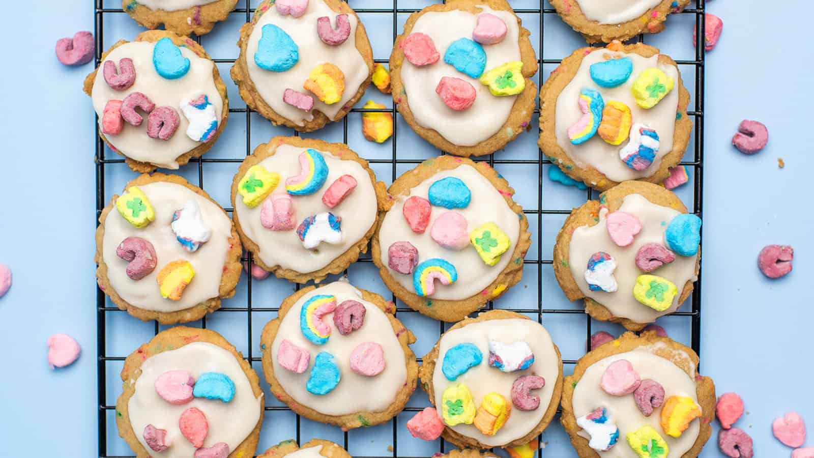Frosted cookies topped with Lucky Charms pieces.