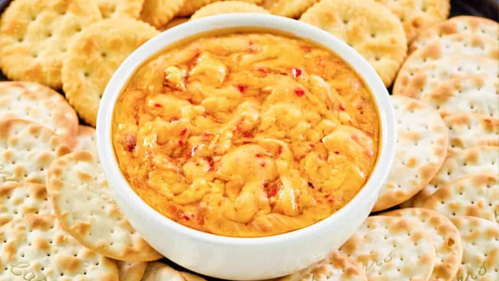 Hot pimento cheese dip baked until bubbly and golden in a serving dish.