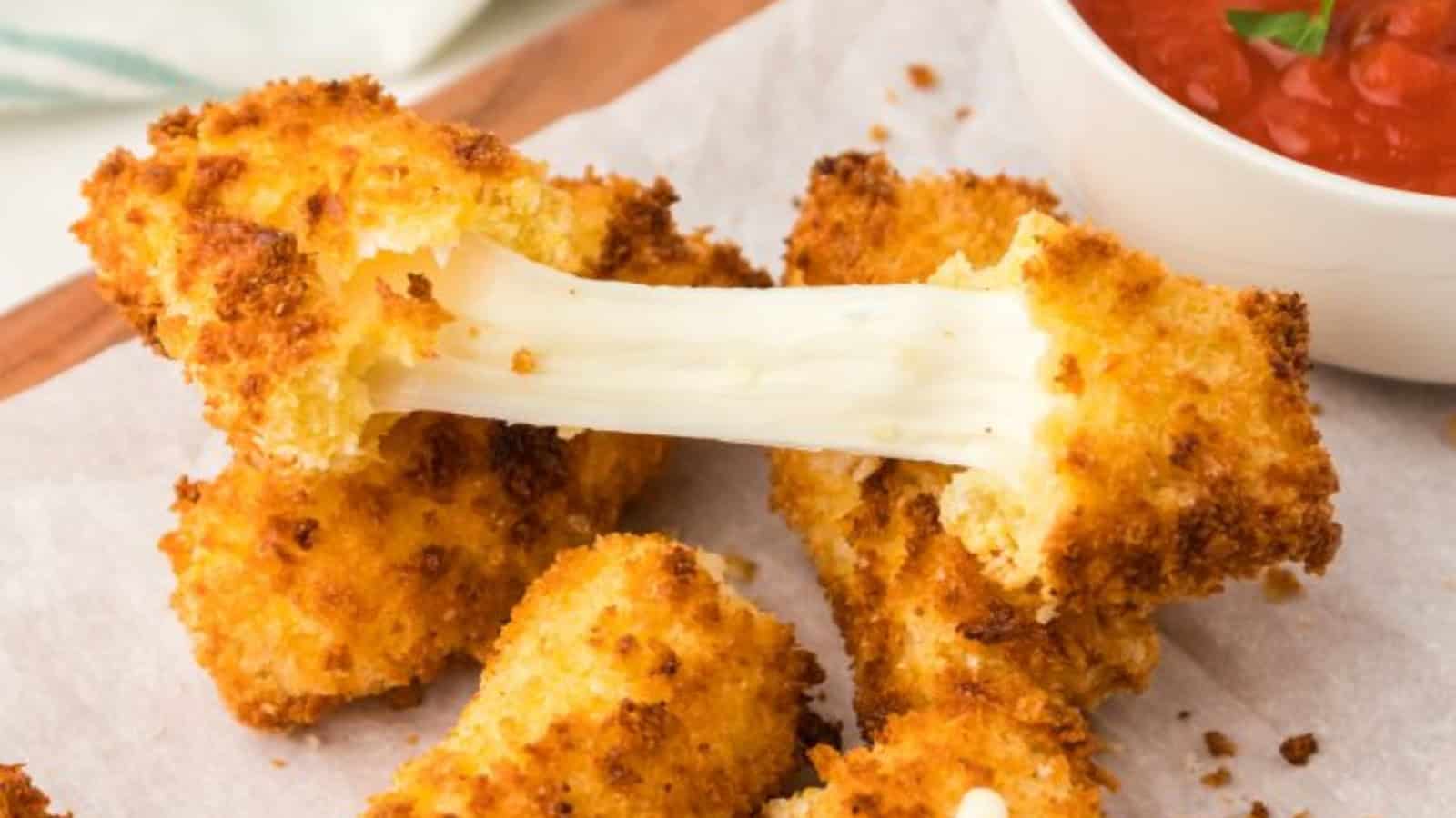 Mozzarella sticks with a crispy breaded coating and melted cheese centers.