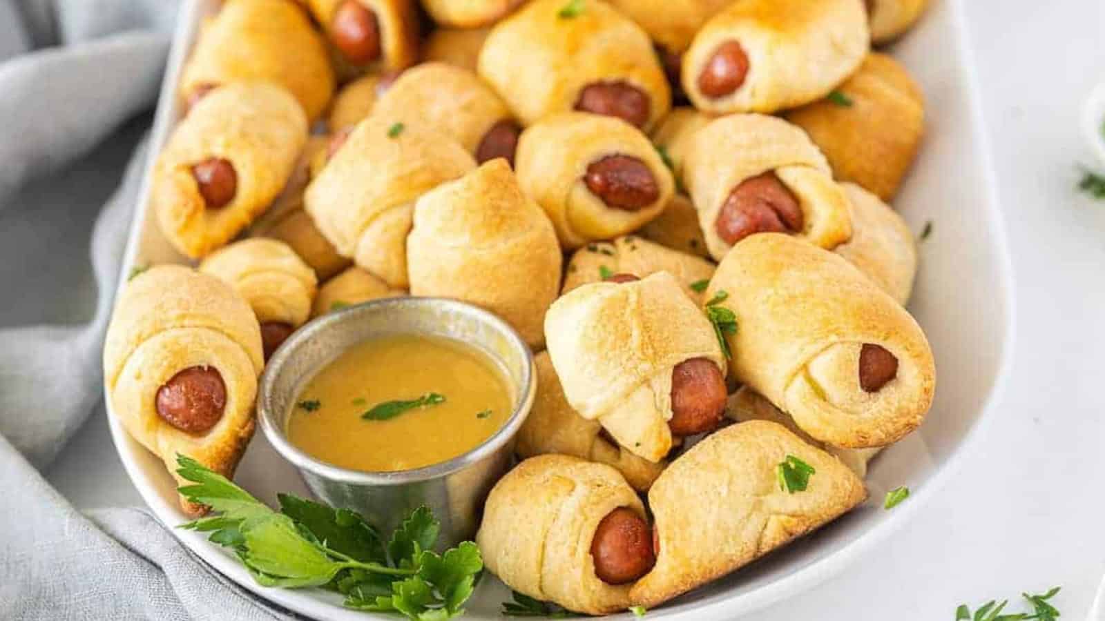 Pigs in a blanket with mini sausages wrapped in golden baked dough.