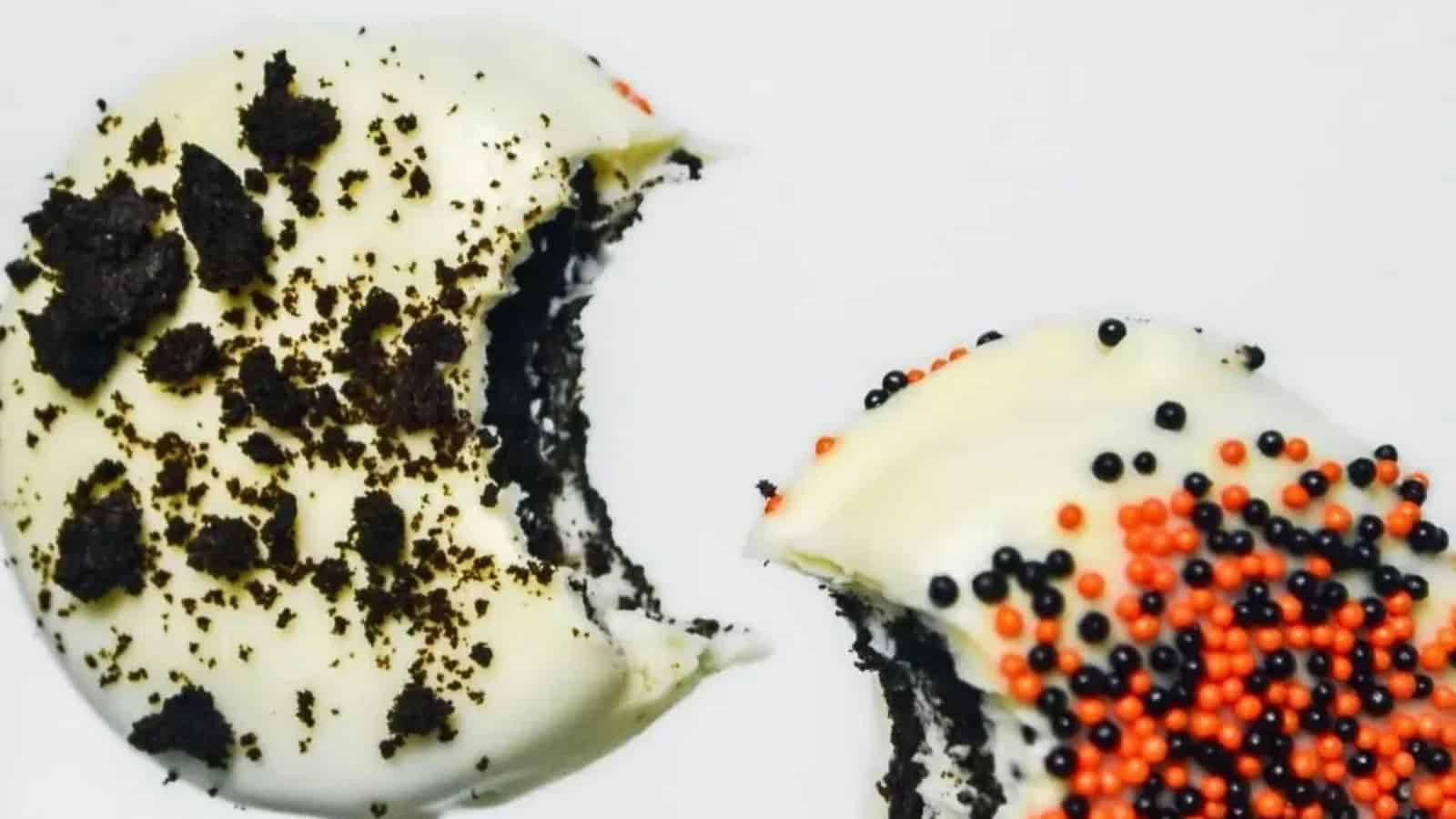 Oreo cookies decorated with Halloween designs and candy eyes.