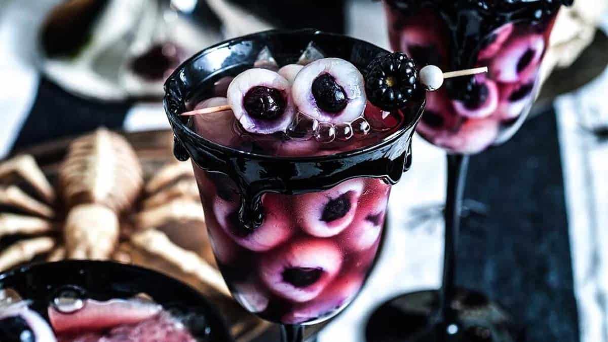 Halloween eyeball punch decorated with floating eyeball garnishes.